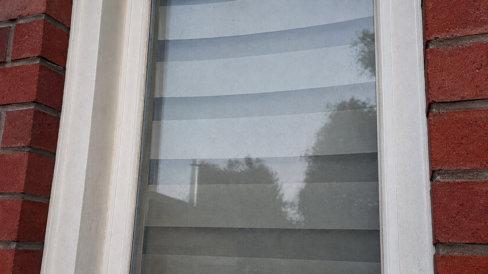 Window before cleaning — dirty, streaked glass